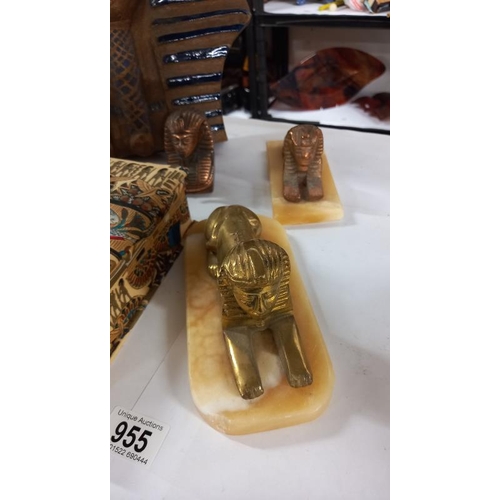 955 - An Egyptian revival face mask, fabric covered box, Sphinxes and photo frame