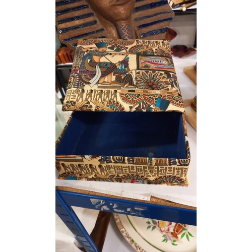 955 - An Egyptian revival face mask, fabric covered box, Sphinxes and photo frame