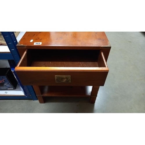 969 - A dark wood stained table with brass corners and fittings plus a drawer