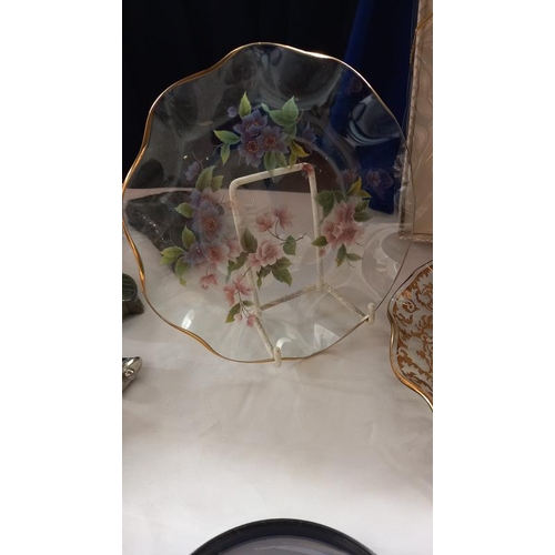 974 - A boxed glass cake stand and 2 other decorative glass plates