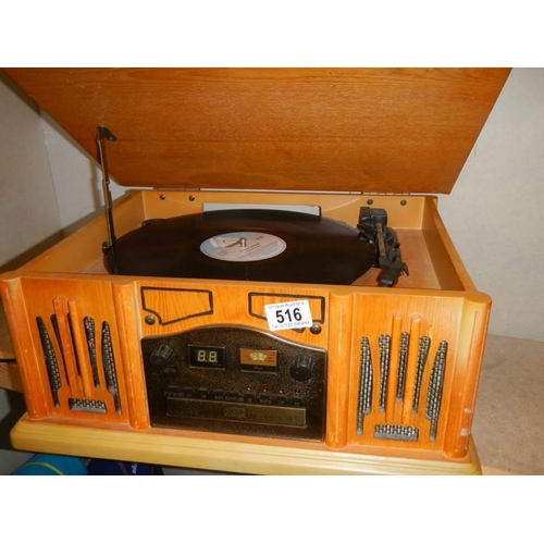 516 - A vintage style record player with radio and CD features, COLLECT ONLY.