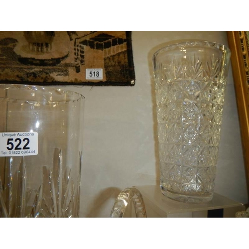 522 - Two cut glass vases, a cut glass basket and a moulded glass vase. COLLECT ONLY.