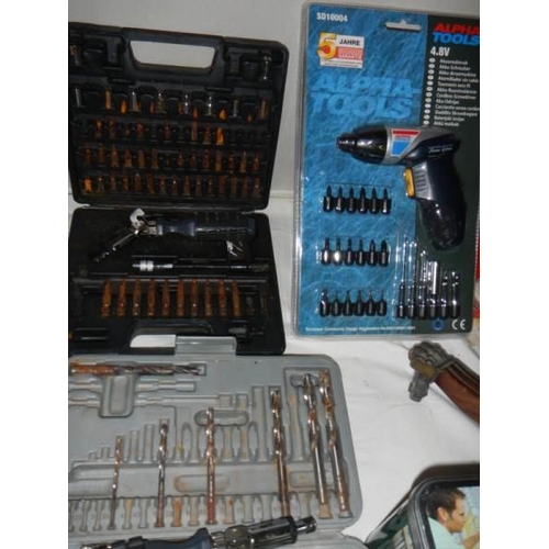 541 - A quantity of cordless screwdriver and attachments,