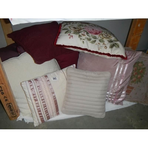 543 - A quantity of cushions,.