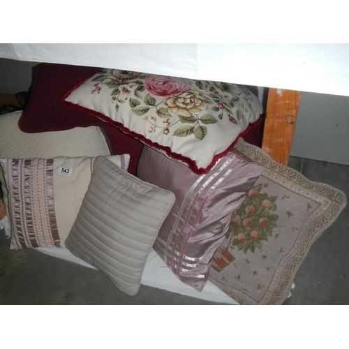 543 - A quantity of cushions,.