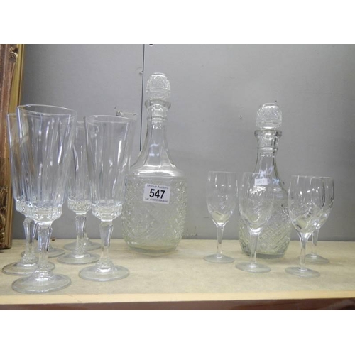 547 - Two glass decanters and a quantity of glasses,. COLLECT ONLY.