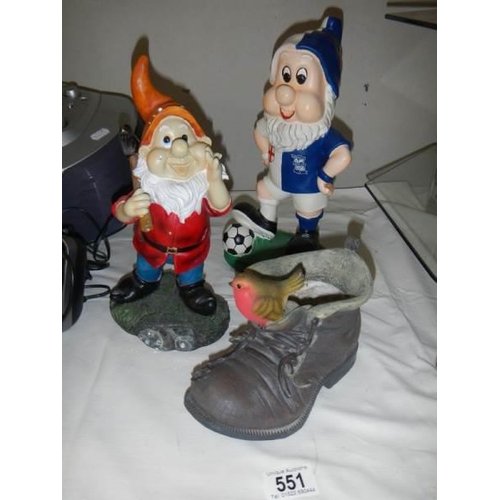 551 - Two garden gnomes and a boot.