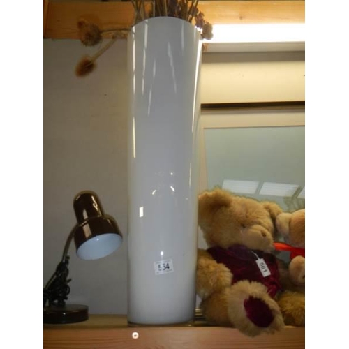 554 - A tall white studio glass vase, 70 cm tall. COLLECT ONLY.