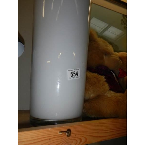 554 - A tall white studio glass vase, 70 cm tall. COLLECT ONLY.