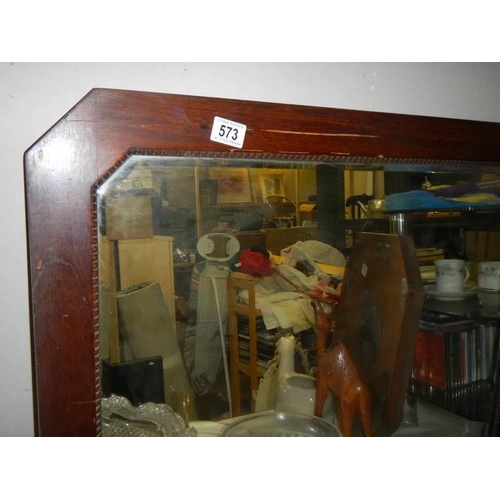 573 - A 1930's oak framed bevel edged mirror, COLLECT ONLY.