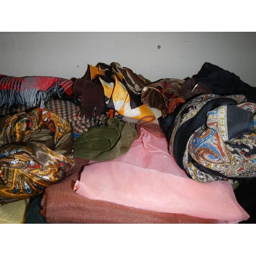 582 - A good lot of scarves, gloves etc.,