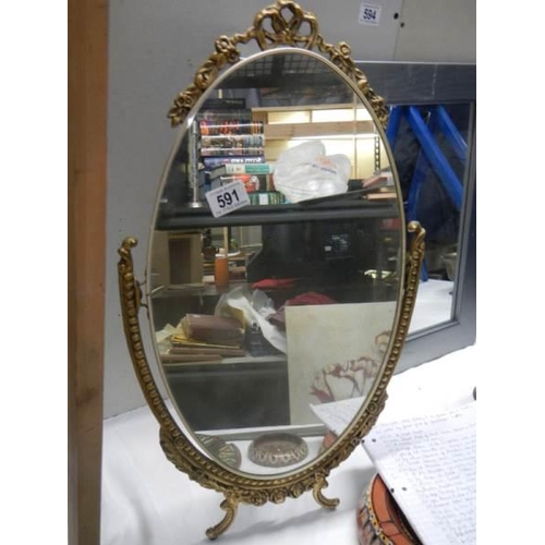 591 - A oval gilt ormolu framed mirror on stand, COLLECT ONLY.