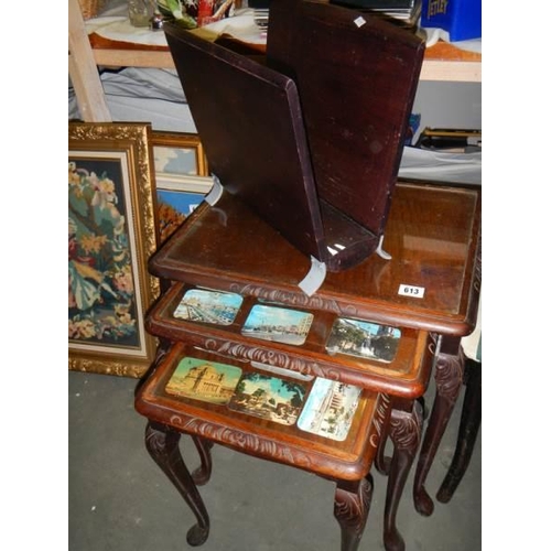 613 - A nest of three glass top tables and a magazine rack. COLLECT ONLY.