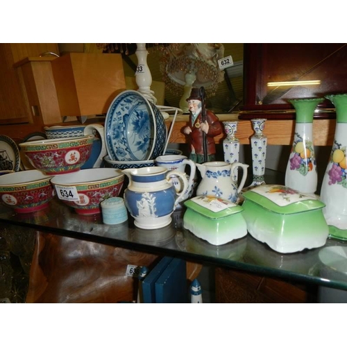 634 - A large lot of ceramics including Chinese finger bowls, Wade veteran car, dishes etc.,