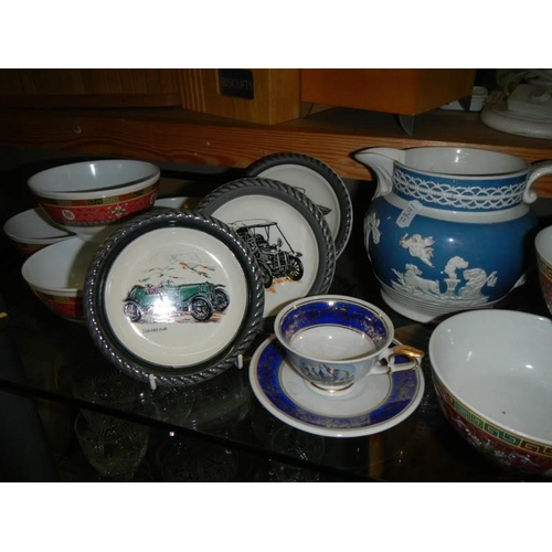 634 - A large lot of ceramics including Chinese finger bowls, Wade veteran car, dishes etc.,