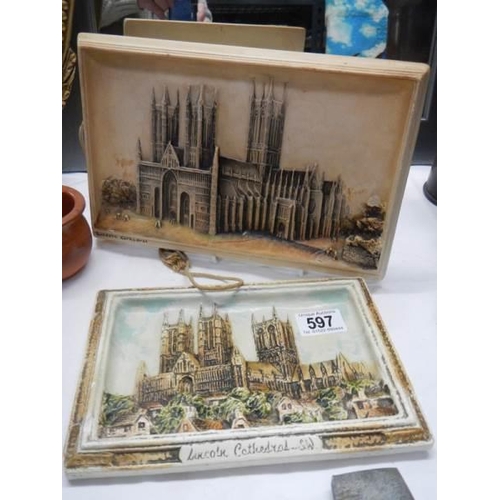 597 - An Osborne ivorex wall plaque of Lincoln Cathedral and one other.