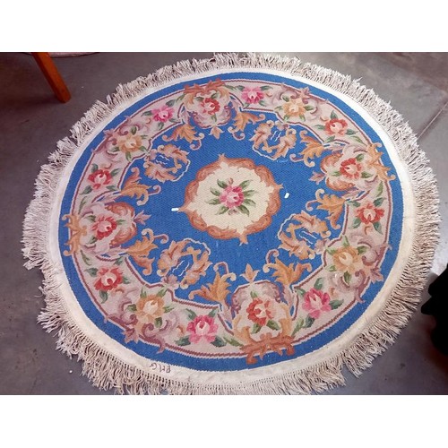 740 - A circular rug - 153cm diameter including tassels COLLECT ONLY