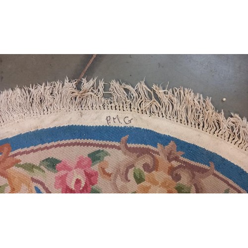 740 - A circular rug - 153cm diameter including tassels COLLECT ONLY