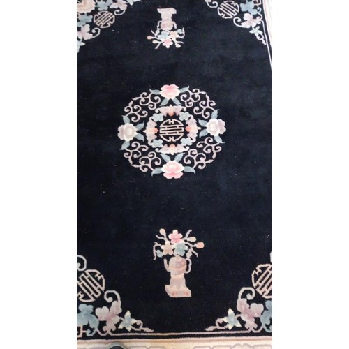 745 - A black & beige rug - 230cm x 143cm (including tassels) COLLECT ONLY