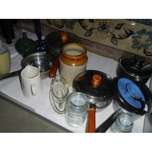 678 - A mixed lot of kitchen ware including saucepans, jugs etc.,