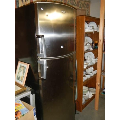 679 - A Whirlpool fridge freezer with stainless front. COLLECT ONLY.