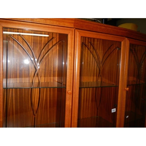 699 - A golden oak wall unit with cut glass doors, COLLECT ONLY.