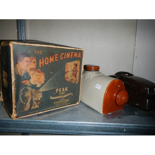 711 - A vintage boxed Peak cine projector, Swan toaster, radio etc.,