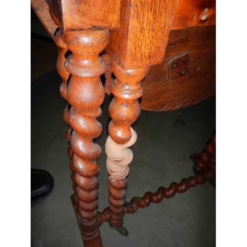 713 - An Edwardian oak Sutherland table, a/f COLLECT ONLY.