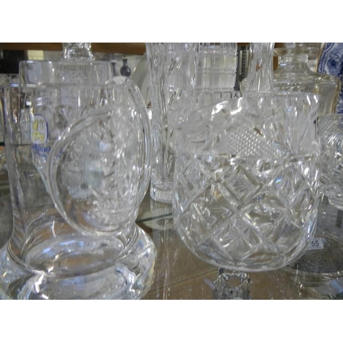 753 - A mixed lot of glass ware including decanters, vases, tankards etc.,