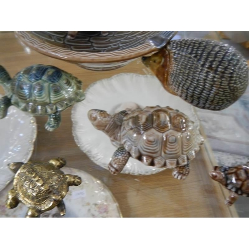 755 - A collection of Wade tortoises and a hedgehog trinket pot.