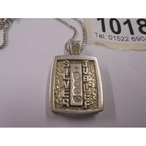 1018 - A silver jubilee pendant on silver chain, 20.8 grams.