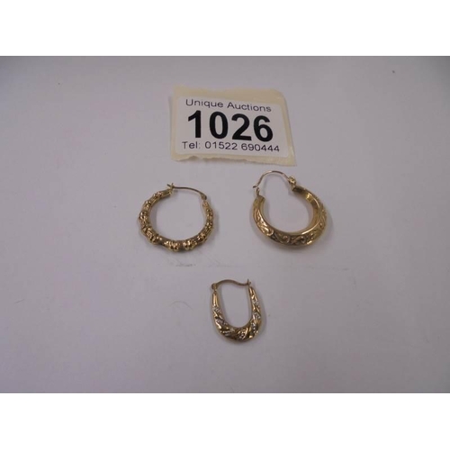 1026 - Three gold earrings, 1.7 grams.