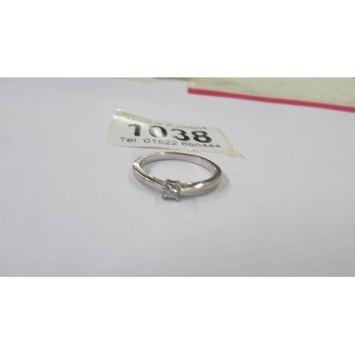 1038 - A platinum diamond solitaire ring, size O half, 2.6 grams.