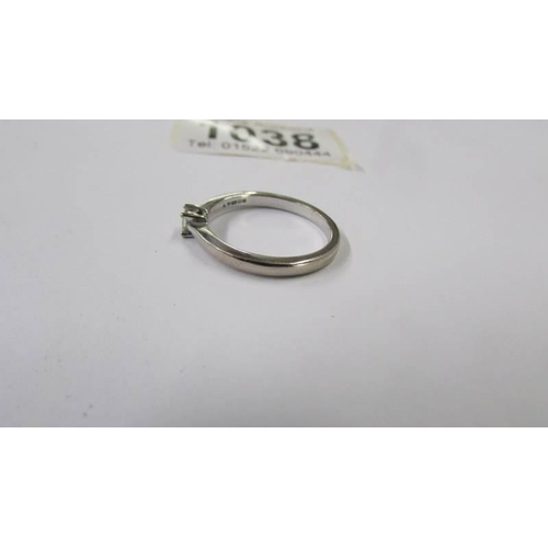 1038 - A platinum diamond solitaire ring, size O half, 2.6 grams.