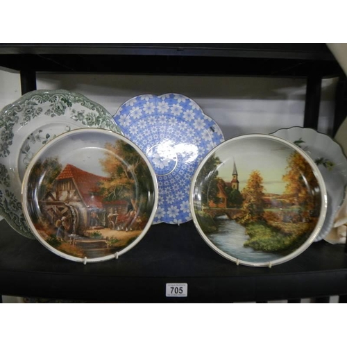 705 - Two country scene collector's plates, two other plates and a flan dish.