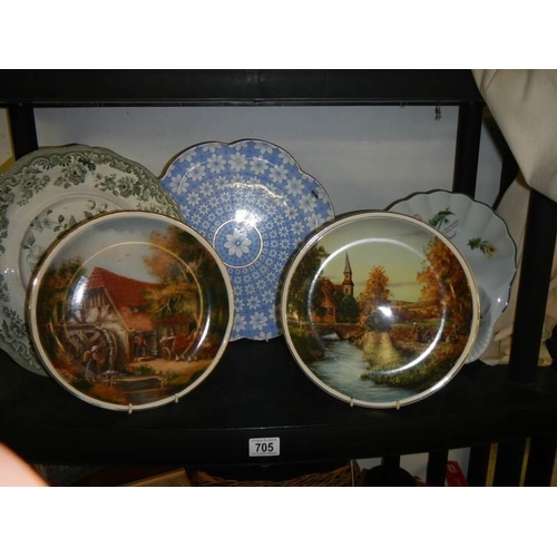 705 - Two country scene collector's plates, two other plates and a flan dish.