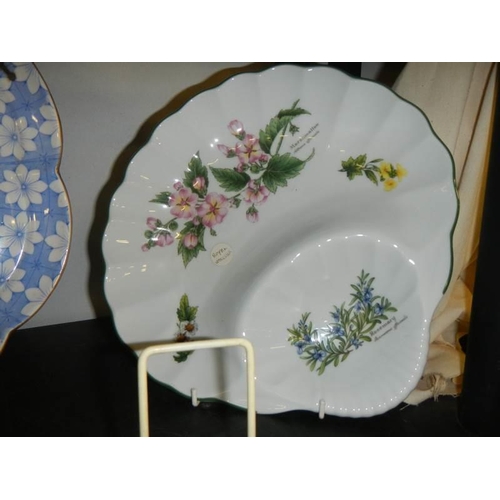 705 - Two country scene collector's plates, two other plates and a flan dish.