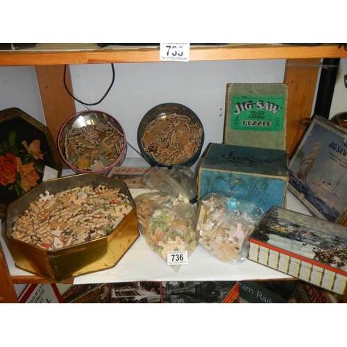 736 - A shelf of old wooden jigsaw puzzles, completeness unknown