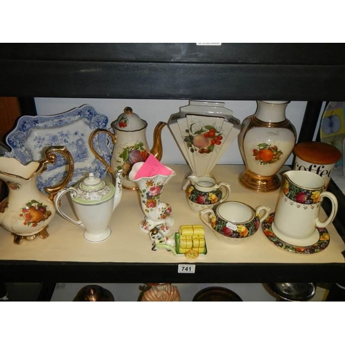 741 - A shelf of ceramics including vases, jugs etc.,