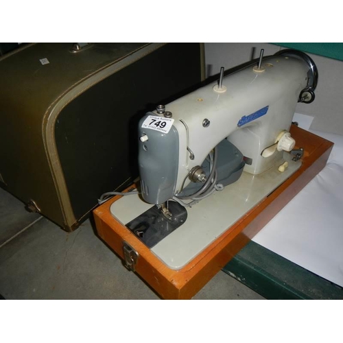 749 - A cased Sapphire sewing machine, COLLECT ONLY.