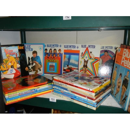 751 - A shelf of Blue Peter annuals.