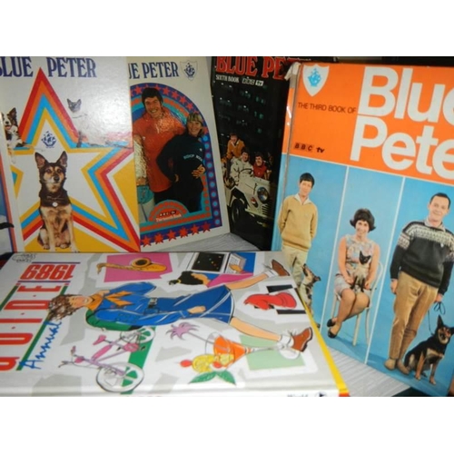 751 - A shelf of Blue Peter annuals.