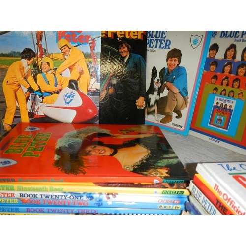 751 - A shelf of Blue Peter annuals.