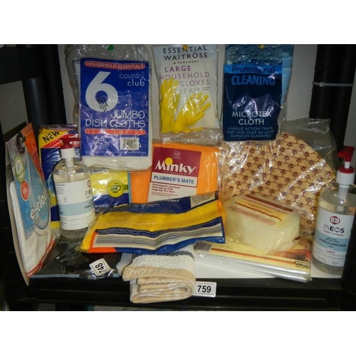 759 - A shelf of assorted cleaning cloths etc.,