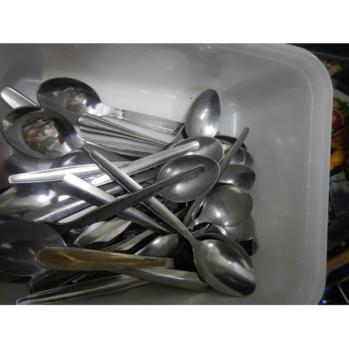 764 - A mixed lot of metal ware including tray, cutlery etc.,