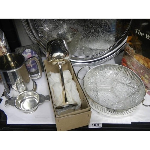 764 - A mixed lot of metal ware including tray, cutlery etc.,