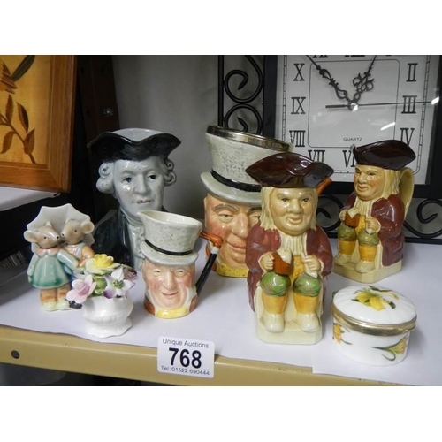 768 - A mixed lot including Toby jugs, trinket box etc.,