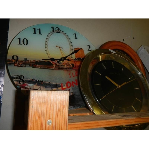 787 - A shelf of assorted wall clocks.