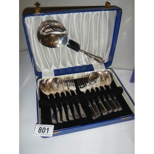 801 - A cased set of dessert spoons and forks with serving spoon.