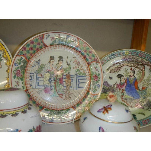 806 - Four oriental plates and two lidded pots.